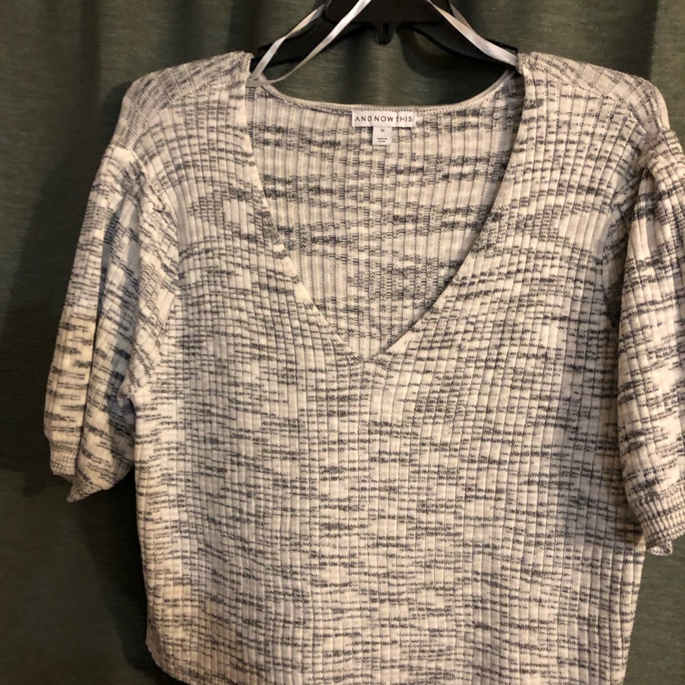 And NowThis short sleeved sweater